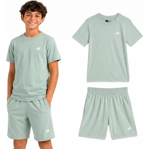 New Balance Boys 2 Piece Cotton Blend Jersey Shirt & Basketball Shorts | Bold Front Design, Breathable Short Sleeve Top, Flexible Fit Built for Sports, Play & Confident Everyday Youth Style(Clay Ash)